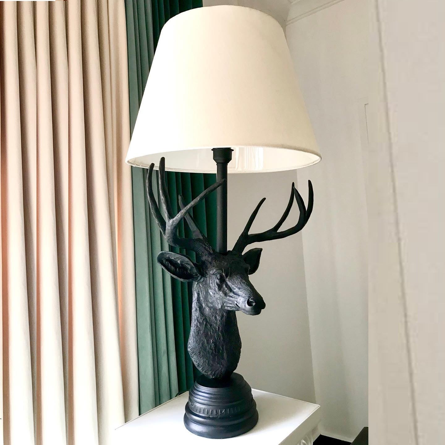 European Deer Table Lamp — rustic animal lamp with matte black sculpted stag base and cream linen shade European Deer Table Lamp — rustic animal lamp with matte black sculpted stag base and cream linen shade