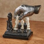 Checkmate Chess Sculpture — modern art sculpture featuring hand-carved chess pieces as wooden home decor, available for sale at Lume Art Gallery