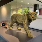 Panther Action Figure – handcrafted metallic gold panther sculpture, a modern floor sculpture available at Lume Art Gallery