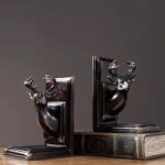 Black Deer Head Bookends – premium animal sculpture with dark metallic and polished gold finish, art sculptures for sale at Lume Art Gallery