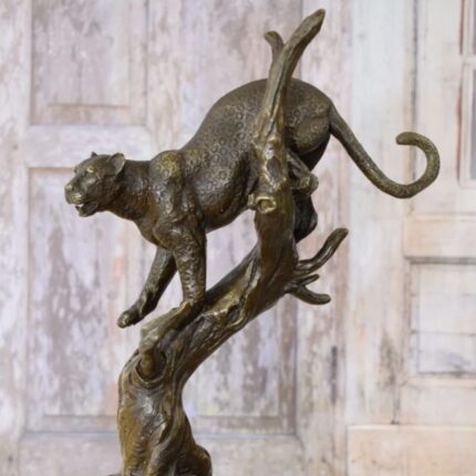 Panther on Branch Sculpture — handcrafted animal sculpture and modern art sculpture for luxury home decor, available for sale at Lume Art Gallery
