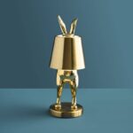 Glossy gold rabbit lamp — LED hiding animal lamp crafted in polyresin, 28 cm, for modern living rooms and home decor