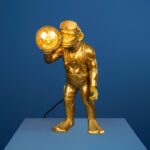 Gold Monkey Lamp — sculptural gold animal lamp with polyresin monkey diver holding illuminated bulb, ideal monkey lamp for modern living rooms