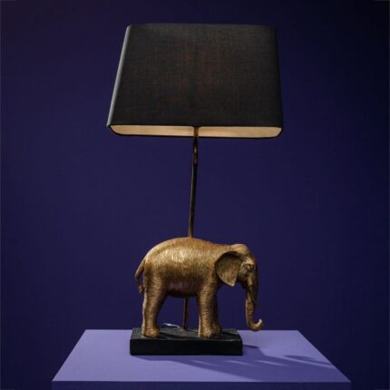 Elmo Elephant Lamp Gold-Black — sculptural elephant lamp with a detailed elephant figure base in gold finish and a black fabric shade, shown on a neutral surface as a decorative art sculpture for living room or entryway styling.