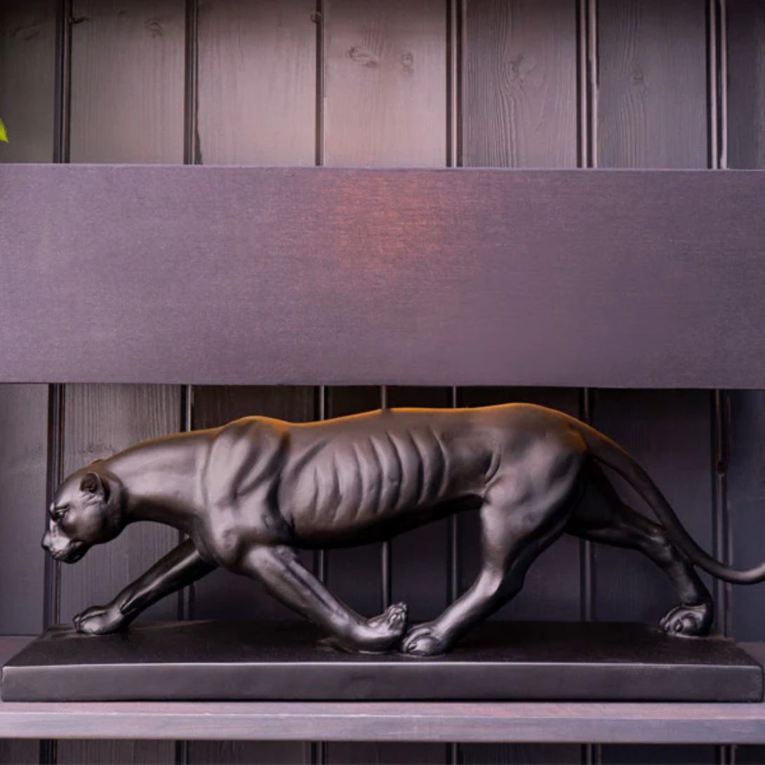 1 BLACK PANTHER LAMP BASE WITH A BLACK AND GOLD LAMP SHADE