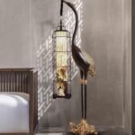 Crane Art Sculpture with hanging lantern — bronze-finish bird sculpture and modern animal sculpture for wooden home decor