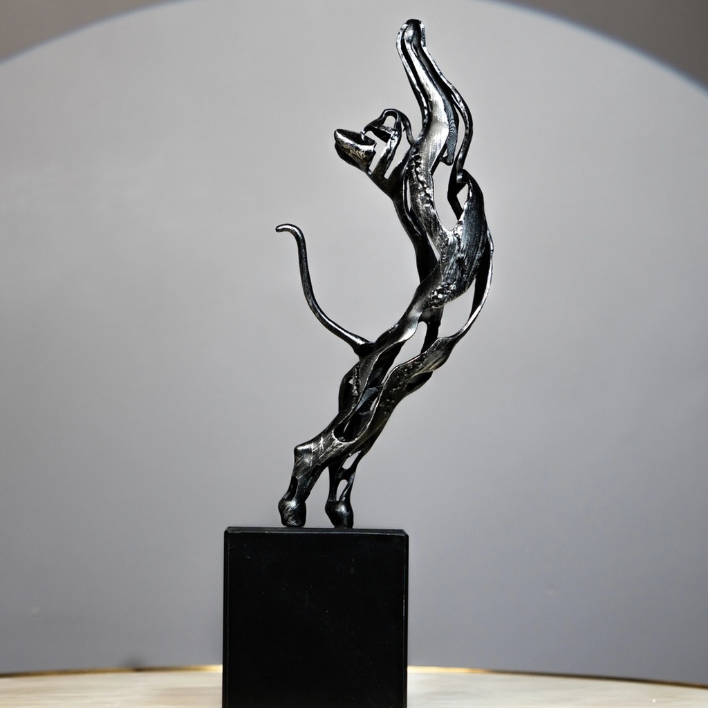Black Feline Sculpture — glossy black cat sculpture of a leaping panther with abstract curves, a modern art sculpture and animal sculpture for sale at Lume Art Gallery Black Feline Sculpture — glossy black cat sculpture of a leaping panther with abstract curves, a modern art sculpture and animal sculpture for sale at Lume Art Gallery