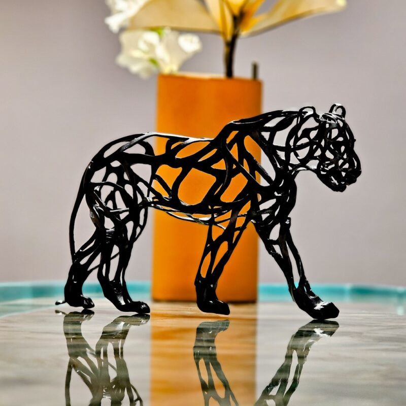 Black Panther Action Figure in black resin finish — modern art sculpture and animal sculpture for luxury home decor, available as an art sculpture for sale at Lume Art Gallery