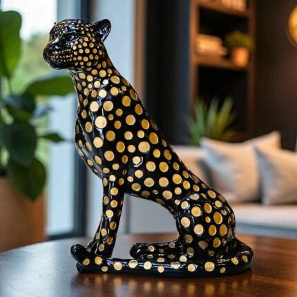 Golden Leopard Art Sculpture in black and gold resin finish — modern animal sculpture for home decor, available as an art sculpture for sale at Lume Art Gallery