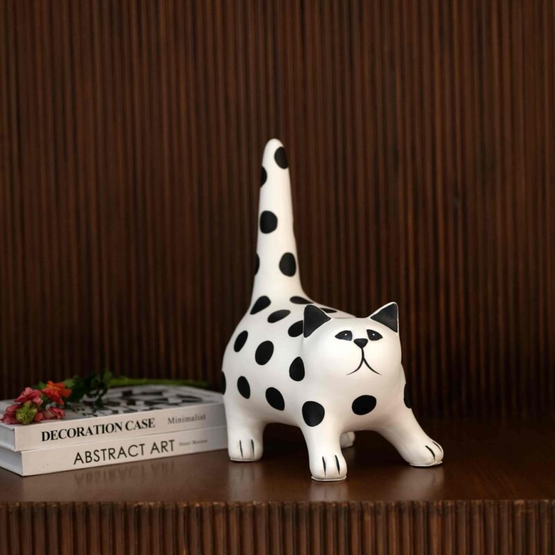 Stretch Cat Sculpture – black and white resin animal sculpture in a stretching pose, modern art sculpture for home decor