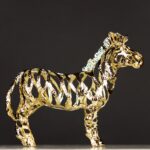 Gold Zebra Sculpture, in iron with intricate openwork design — luxury animal sculpture and art sculpture for home décor by Lume Art Gallery