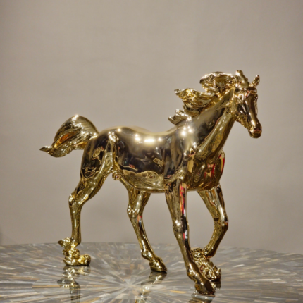 Golden Horse Sculpture - handcrafted golden resin animal sculpture of a galloping stallion, ideal as a luxury home decor piece from Lume Art Gallery