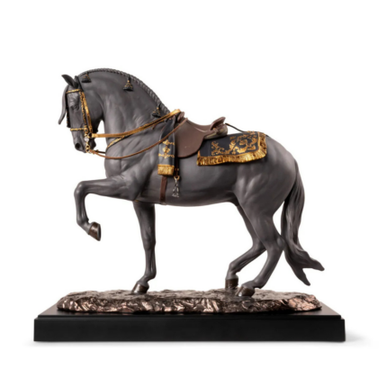 SPANISH PURE BREED BLACK HORSE SCULPTURE in piaffe stance with gold luster saddle, bridle, and genuine leather reins