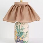 BERNADETTE TABLE LAMP WITH CARVED CERAMIC BASE AND SKIRTED SHADE