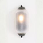 THE ELOISE SCALLOP CLEAR GLASS WALL SCONCE IN BLACK