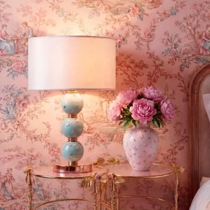 BUTTERFLY SPHERE TABLE LAMP AQUAMARINE with three stacked aquamarine porcelain spheres in high-relief butterfly motifs and 24ct gold on a gold-plated brass base