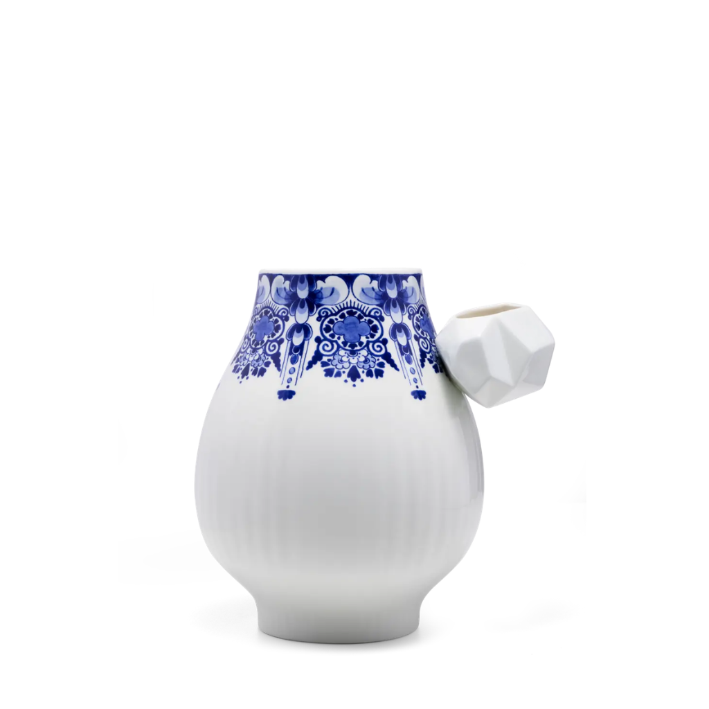 DELFT BLUE SIDE OPENING VASE BY MARCEL WANDERS with baroque cobalt blue pattern, rounded body, and geometric faceted diamond-shaped side opening DELFT BLUE SIDE OPENING VASE BY MARCEL WANDERS with blue pattern, rounded body, and faceted diamond-shaped side opening