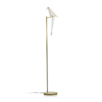 PERCH FLOOR LAMP BY UMUT YAMAC with single white origami bird on a horizontal brass arm atop a slender gold stem and disc base