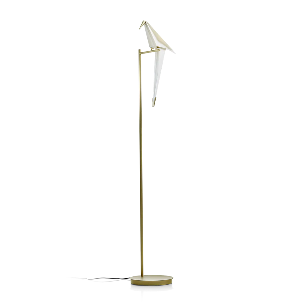 PERCH FLOOR LAMP BY UMUT YAMAC with single white origami bird on a horizontal brass arm atop a slender gold stem and disc base PERCH FLOOR LAMP BY UMUT YAMAC with single white origami bird on a horizontal brass arm atop a slender gold stem and disc base