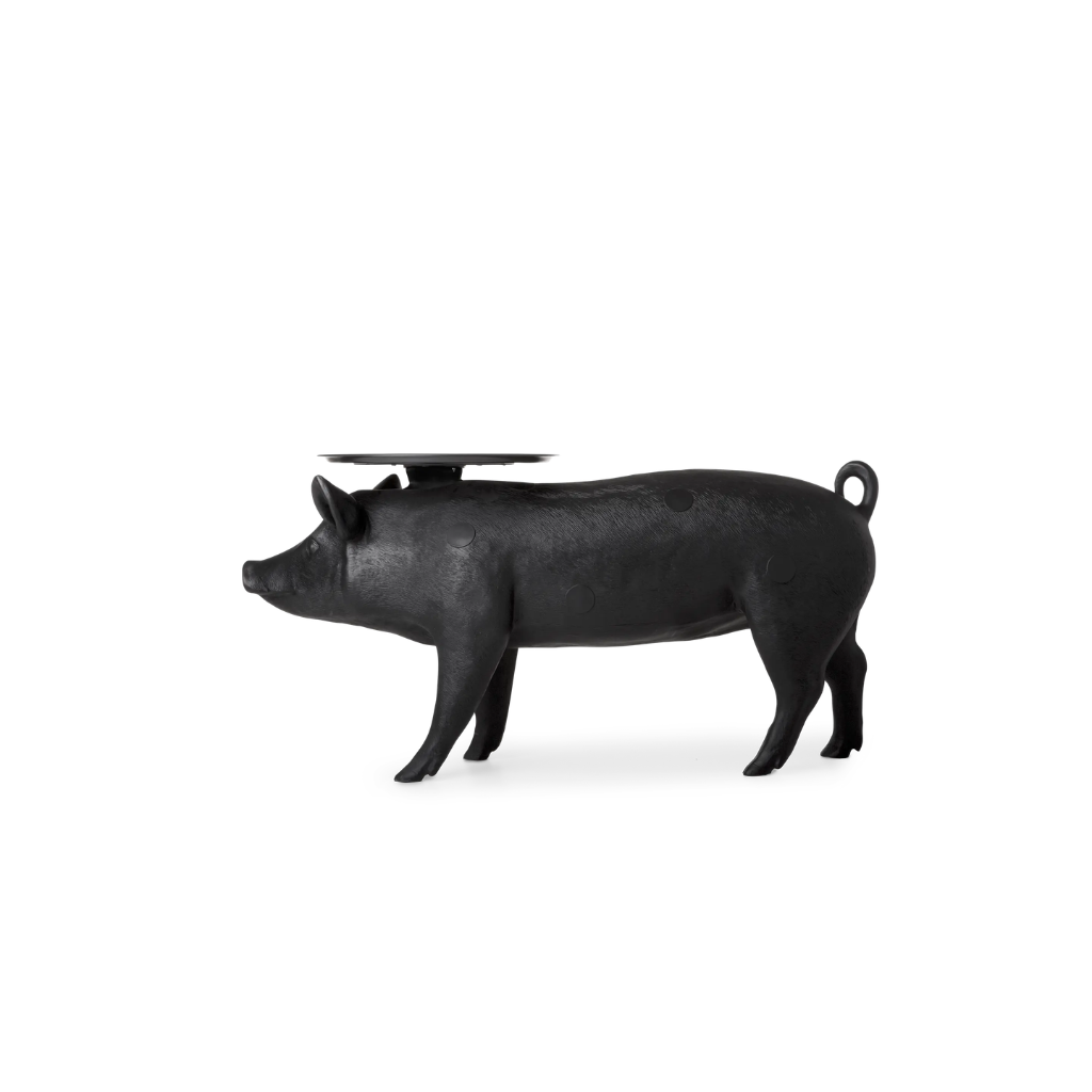 PIG SCULPTURAL TABLE BY FRONT, matte black life-size with circular black tray on back, side profile view on white background PIG SCULPTURAL TABLE BY FRONT, matte black life-size with circular black tray on back, side profile view on white background