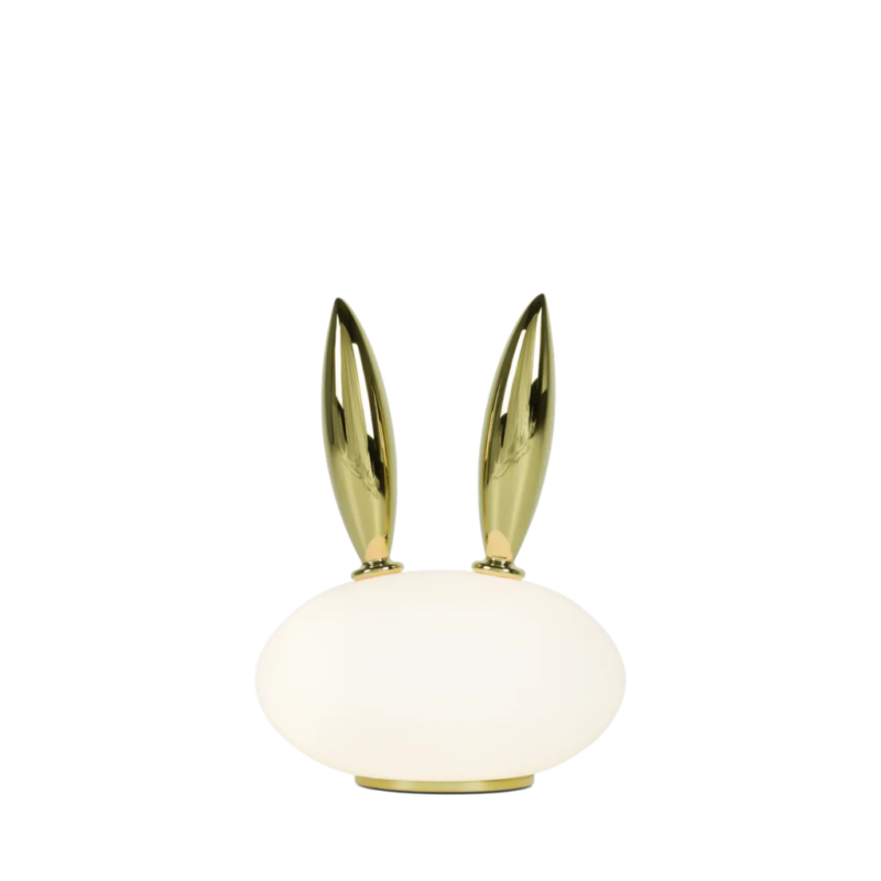 RABBIT PET TABLE LAMP BY MARCEL WANDERS — frosted opal blown glass oval body with two tall polished gold gilded porcelain rabbit ears and circular gold base