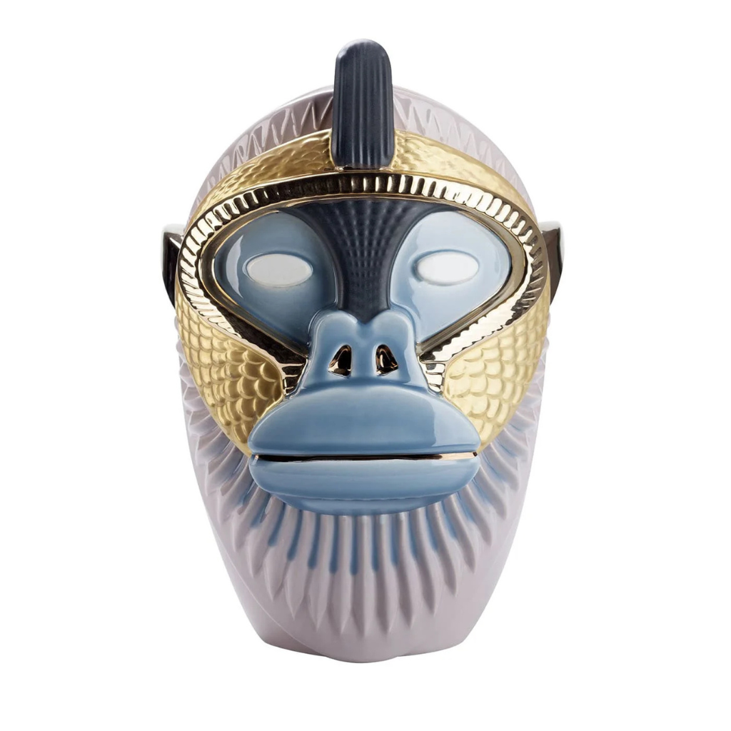 PRIMATES KANDTI GLOSSY LILAC CERAMIC WITH METAL DETAILS VASE with sculpted ape face, gold scale-texture panels, steel blue face mask, and navy spike crest, front view PRIMATES KANDTI GLOSSY LILAC CERAMIC WITH METAL DETAILS VASE with sculpted ape face, gold scale-texture panels, steel blue face mask, and navy spike crest, front view