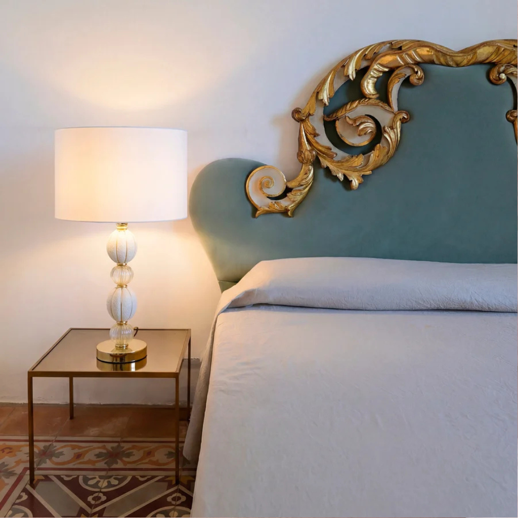 AMOUR TABLE LAMP WHITE GOLD with stacked ribbed white Murano glass spheres and 24ct gold accents on a gold-plated brass base, white drum shade, made in Italy AMOUR TABLE LAMP WHITE GOLD with stacked ribbed white Murano glass spheres and 24ct gold accents on a gold-plated brass base, white drum shade, made in Italy