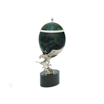 BOX PENSHELL ON EAGLE with silver finial, held aloft by a detailed silver eagle sculpture on dark oval marble base